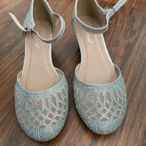 Silver dress shoes with rhinestones.